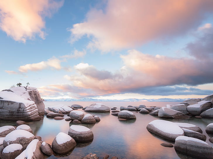 snow covered rocks on body of water under blue and white cloudy sky during daytime, lake tahoe, lake tahoe