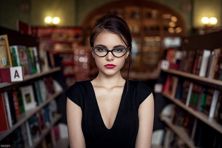 women's black framed eyeglasses, shallow focus photography of woman in black top