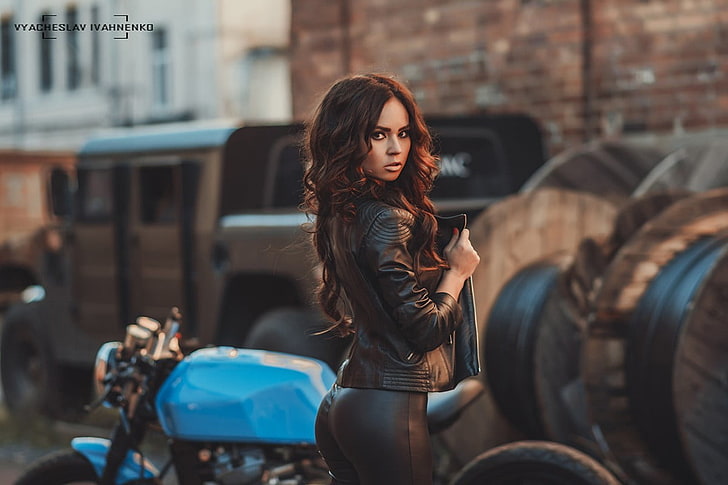 women's black leather zip-up biker's jacket and blue cafe racer