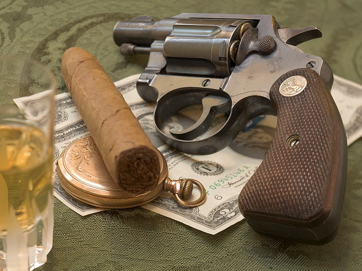 colt revolver, indoors, table, still life, no people, high angle view
