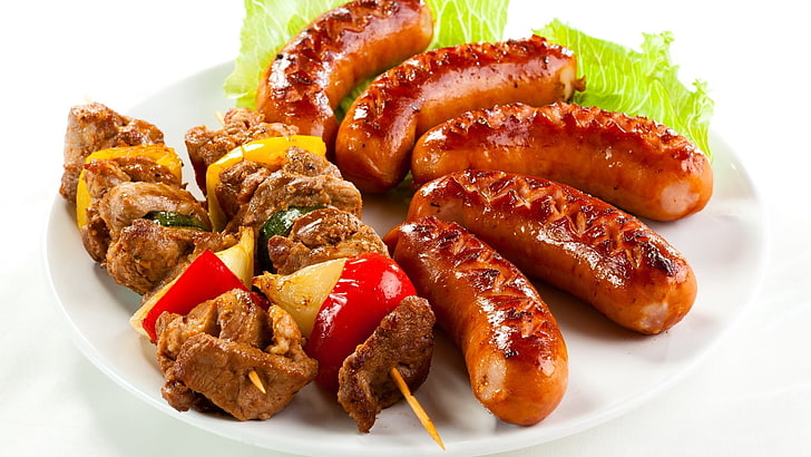 skewered meat and sausage, shish kebab, sausages, fried, greens