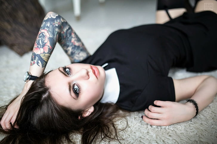 on the floor, hands on head, model, black dress, black stockings
