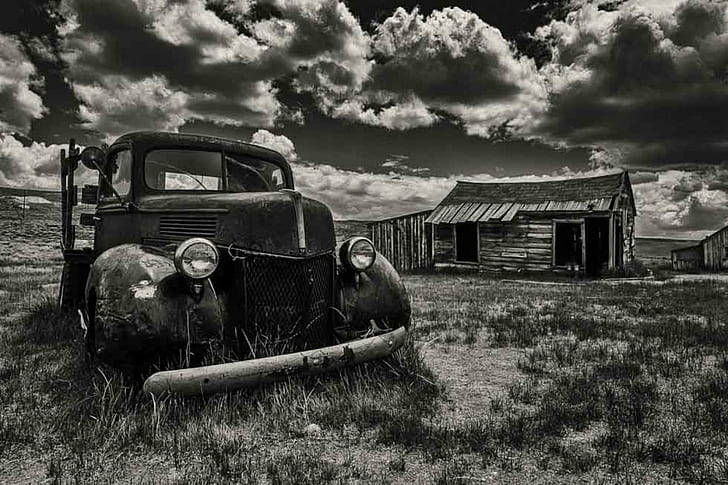 greyscale photo of classic car under cloudy sky, Whispers, past