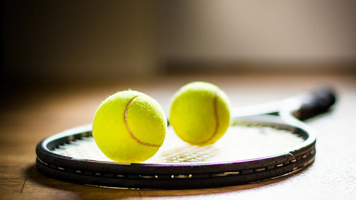 Rackets and balls, black tennis racket and 2 green tennis ball