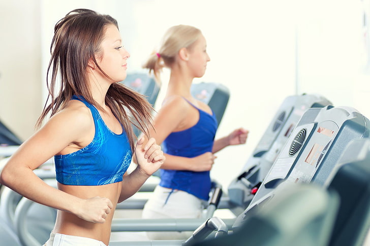 women's blue sport bra, treadmills, exercising, fitness model