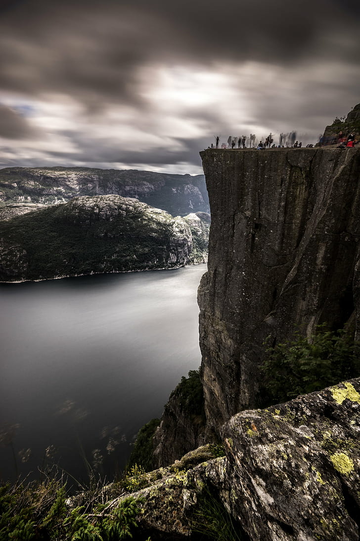 group taking photo near cliff at cloudy day, preikestolen, norway, preikestolen, norway