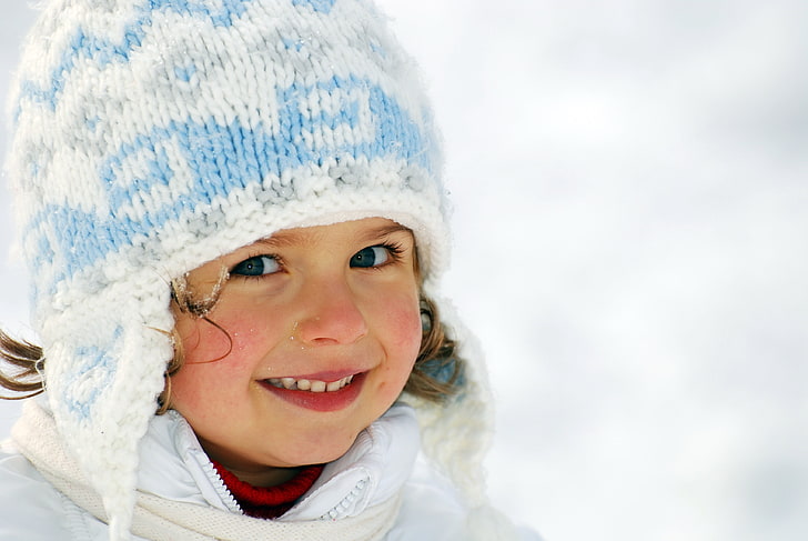 girl's white and blue knitted cap, winter, hat, cheeks, frost