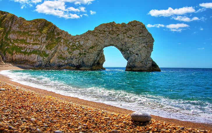 Durdle Door in Summer, beige sand beach with rock formation picture