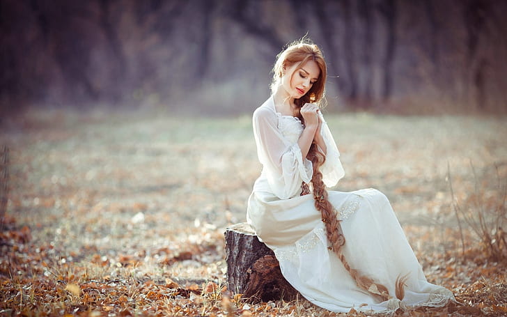 White dress girl, sitting on stump, long blonde hair