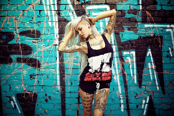 women's black tank top, tattoo, blonde, sidecut, tunnel, graffiti