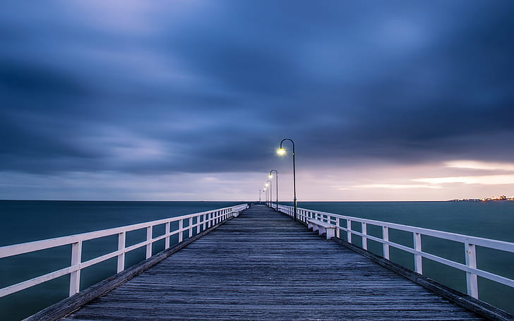 Australian landscape, wooden bridge, night lights, blue sea and sky