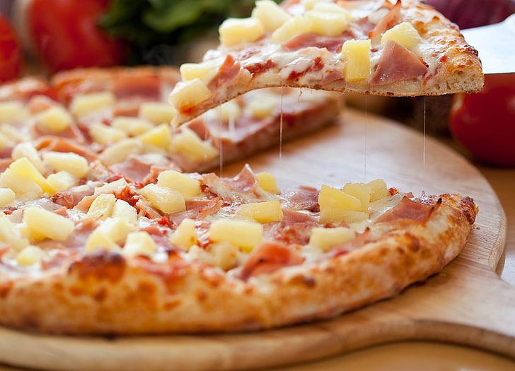 pizza with ham and pineapple, slice, sausage, cheese, board, table