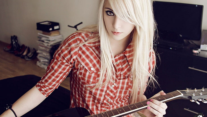 women's red and white button-up top, guitar, blonde, dyed hair