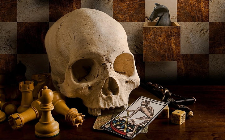 white human skull with chess pieces and tarot card, death, playing cards