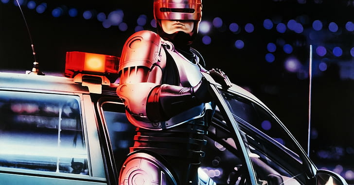 robocop with police car, night, one person, illuminated, headwear