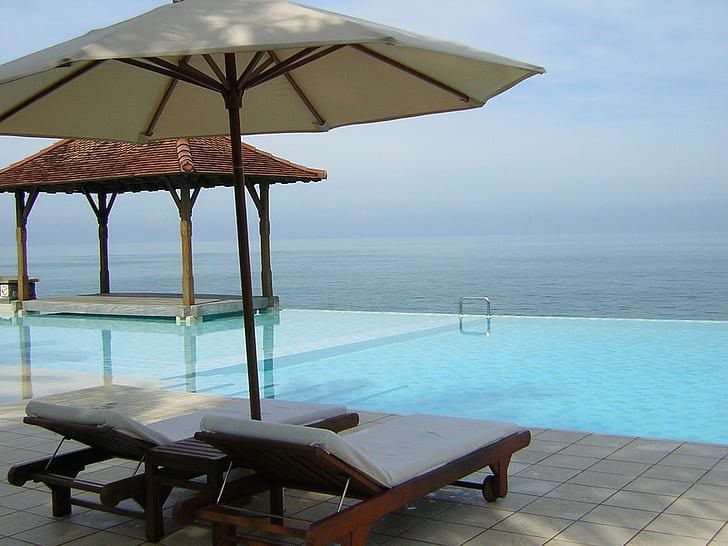 sri lanka chairs deck ocean pool umbrellas HD, 2 brown wooden padded sun loungers and white parasol
