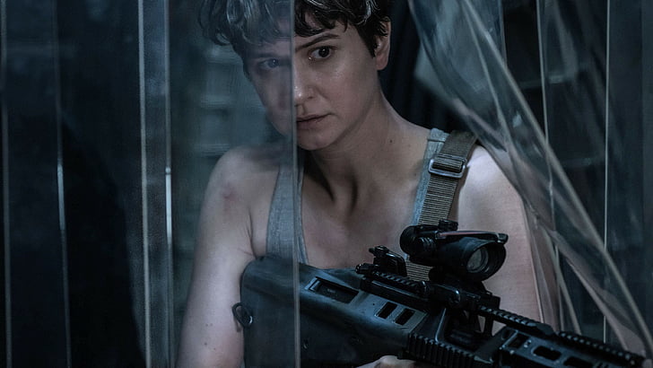 woman wearing gray tank top holds black rifle with scope, Alien: Covenant