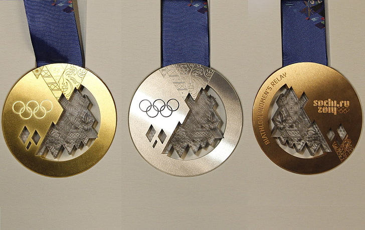 three assorted-color Olympic medals, gold, silver, bronze, olympic games