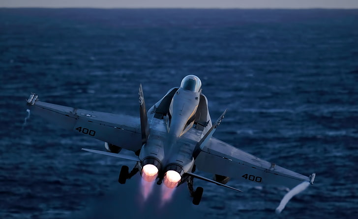 An FA-18C Hornet launches, gray jet plane, Army, Navy, Military