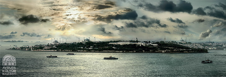 landscape photography of city surrounded by body of water, mosque