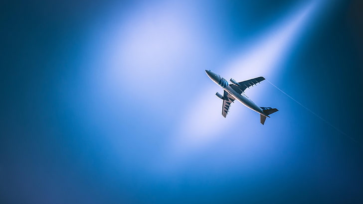 airplane, flying, blue sky, spotlight, illuminated, mid-air