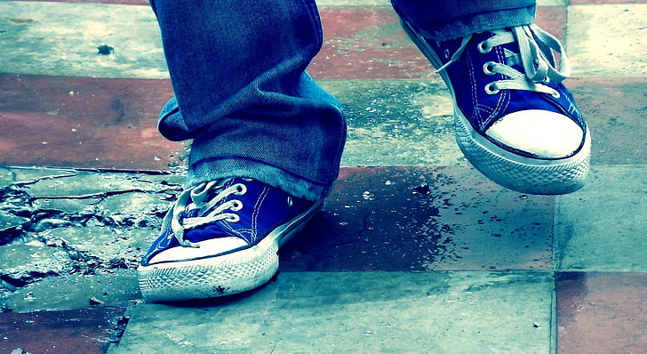 pair of blue-and-white low-top sneakers, legs, shadows, shoes