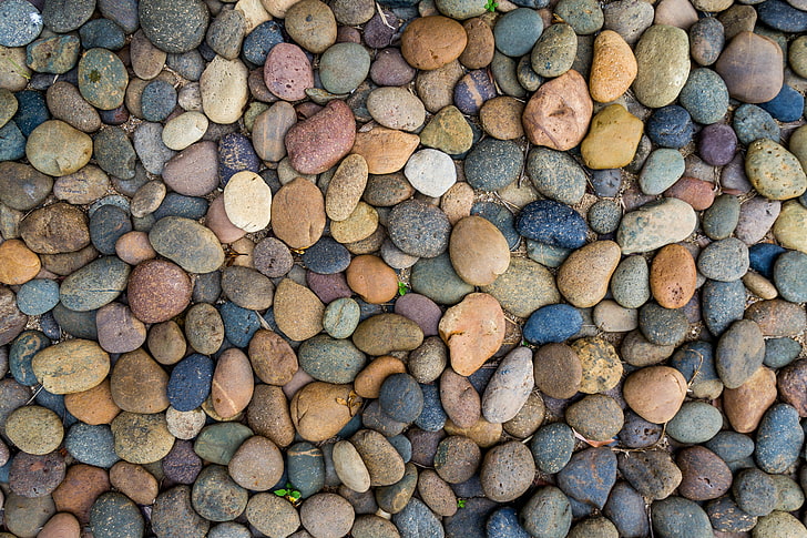 white, yellow, and blue stone pebbles, beach, stones, background