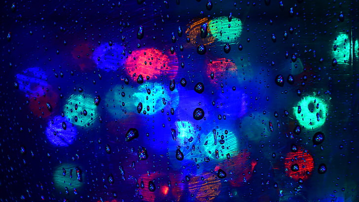 bokeh lights, closeup photo of green, red, and blue lights with water drops