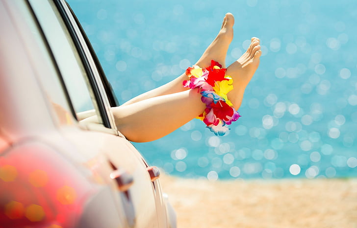 person with multicolored petaled flower anklet lying inside vehicle near sea, HD wallpaper