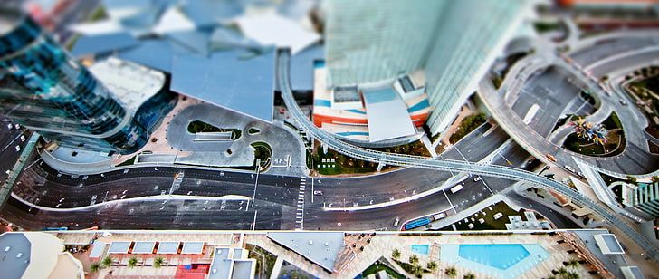 tilt-shift photography of city road intersections, aerial photo of city