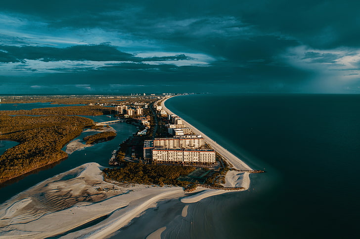 aerial photography of buildings near coastline, USA, shore, sand