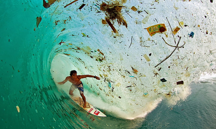 man on surfboard, surfing, trash, blue, tropical water, one person