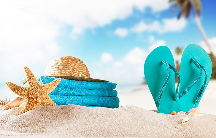 pair of teal flip-flops and brown sun hat, sand, beach, towel