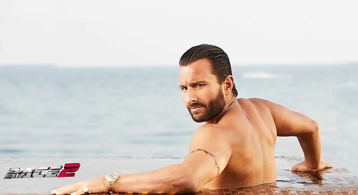 Saif Ali Khan In Race 2 Movies, round gold-colored analog watch with link bracelets with text overlay