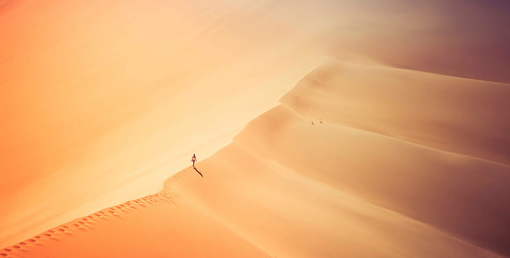 landscape photography of person standing on desert, bel, bel