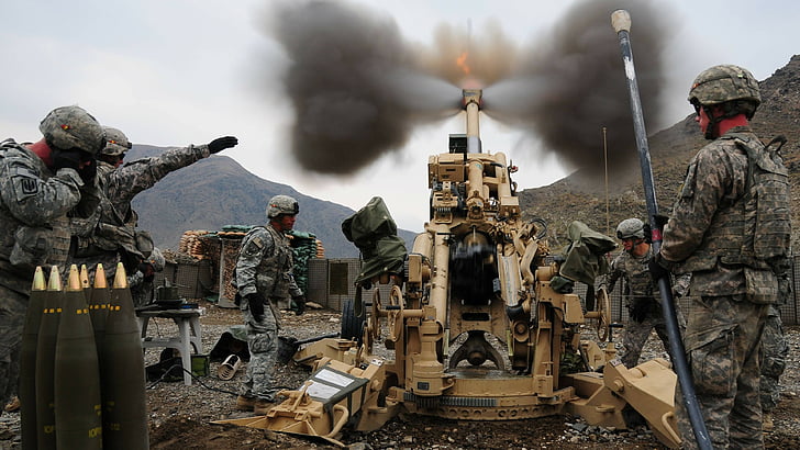 soldiers firing the brown metal canon during daytime, M777, howitzer