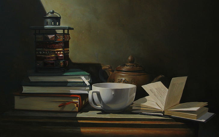 Tea and books, white ceramic mug and assorted books, photography