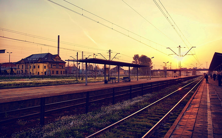 photo of train rails during sunset, railway station, sunlight