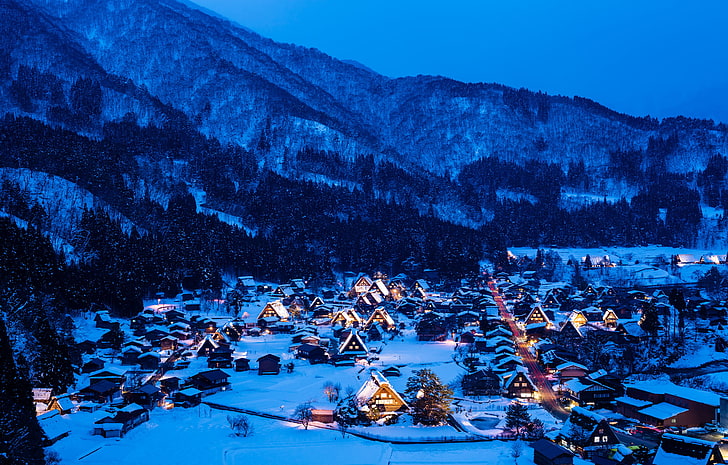 black and orange village overview, winter, snow, mountains, night
