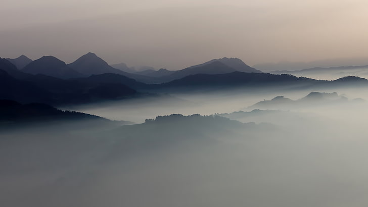 black mountains surrounded by white fogs, landscape, mist, sunrise