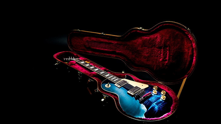 blue electric guitar, Les paul, studio shot, indoors, black background