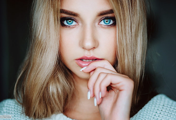 women's teal knit top, blonde, face, blue eyes, portrait, closeup