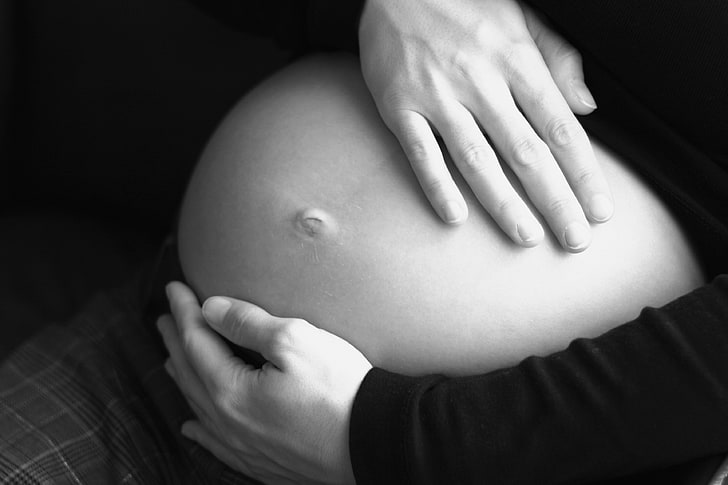 pregnant, holding belly, monochrome, human body part, human abdomen