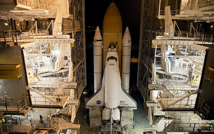 landscape photo of space shuttle inside facility, Space Shuttle Discovery