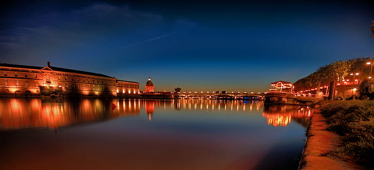 reflection of lighted city buildings on body of water during nighttime, garonne, garonne