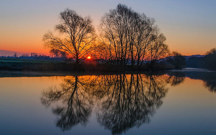 England landscape, evening sunset, trees, river, water surface reflection