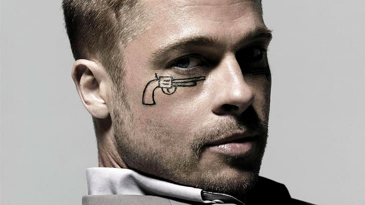 A Guide To Brad Pitt Tattoos and What They Mean