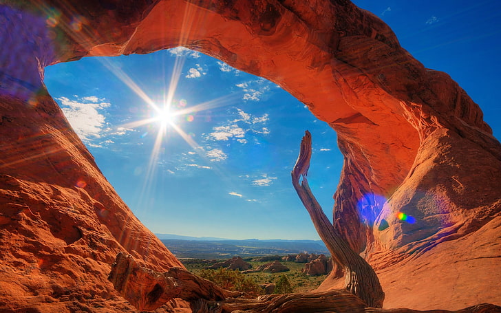 archway rock formation, desert, sky, beauty in nature, sunlight