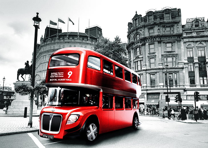 selective color photo of red double decker bus, London, black and white