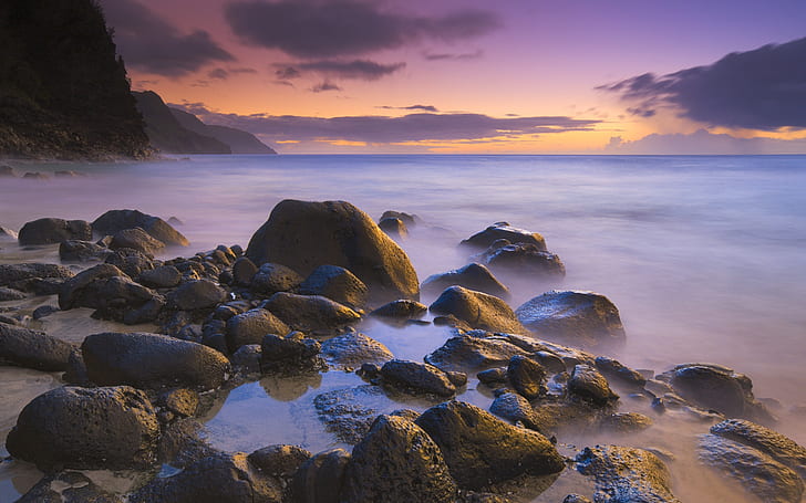 Rocks on the beach at sunset, Hawaii, USA, rock on body of water photo
